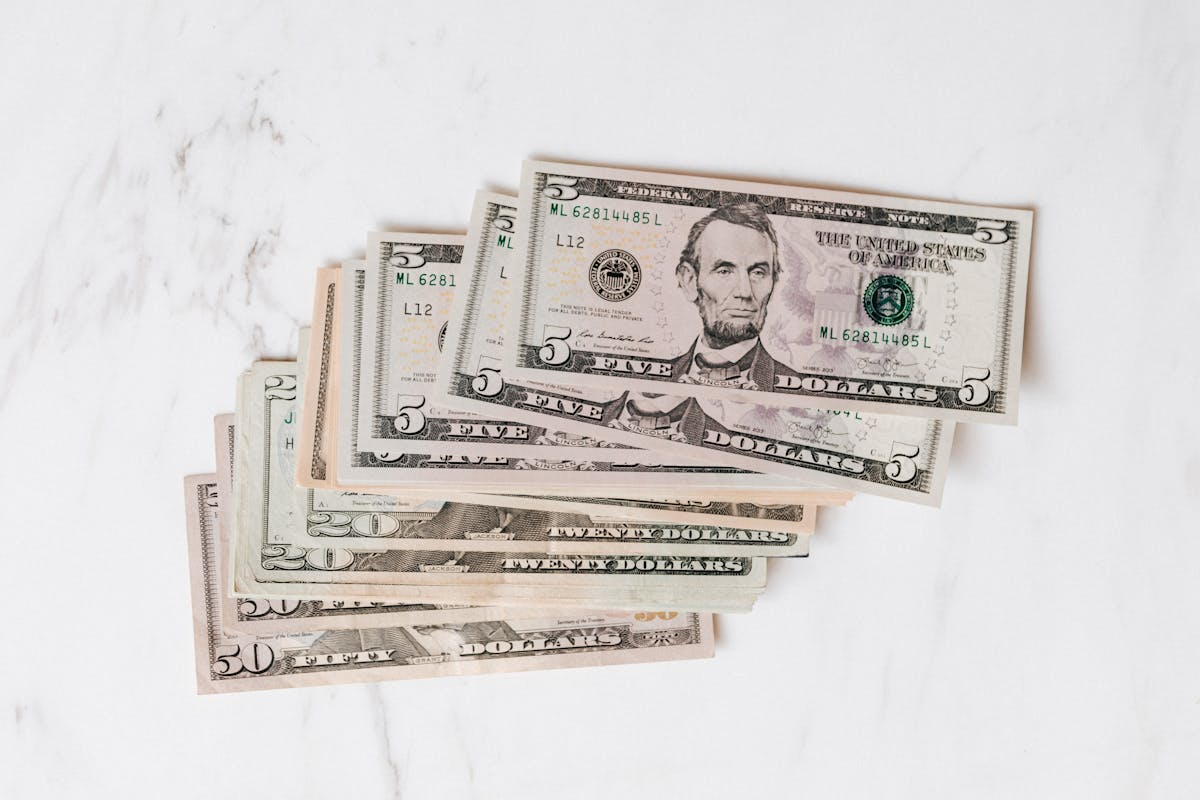 US dollar bills arranged on a table illustrating inflation erosion of purchasing power over time