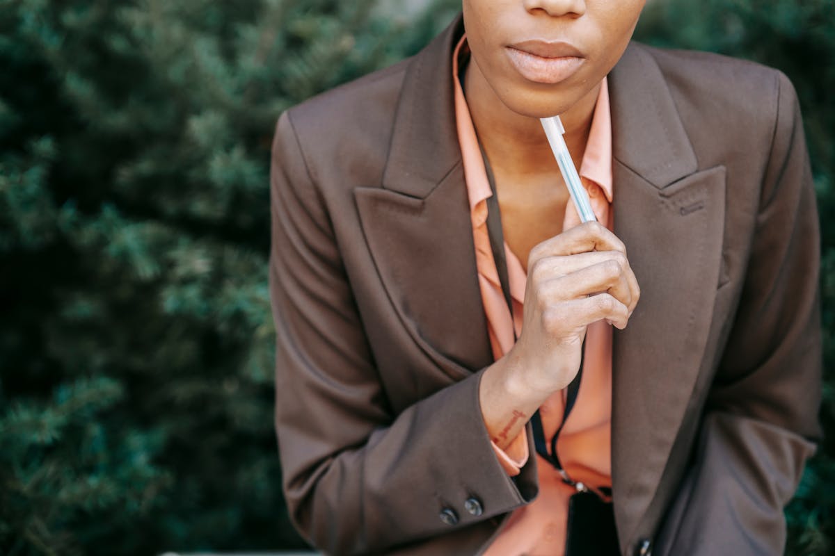 Thoughtful professional weighing the decision to accept or turn down a pay raise offer